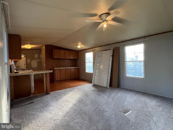 a view of a kitchen with furniture and a kitchen
