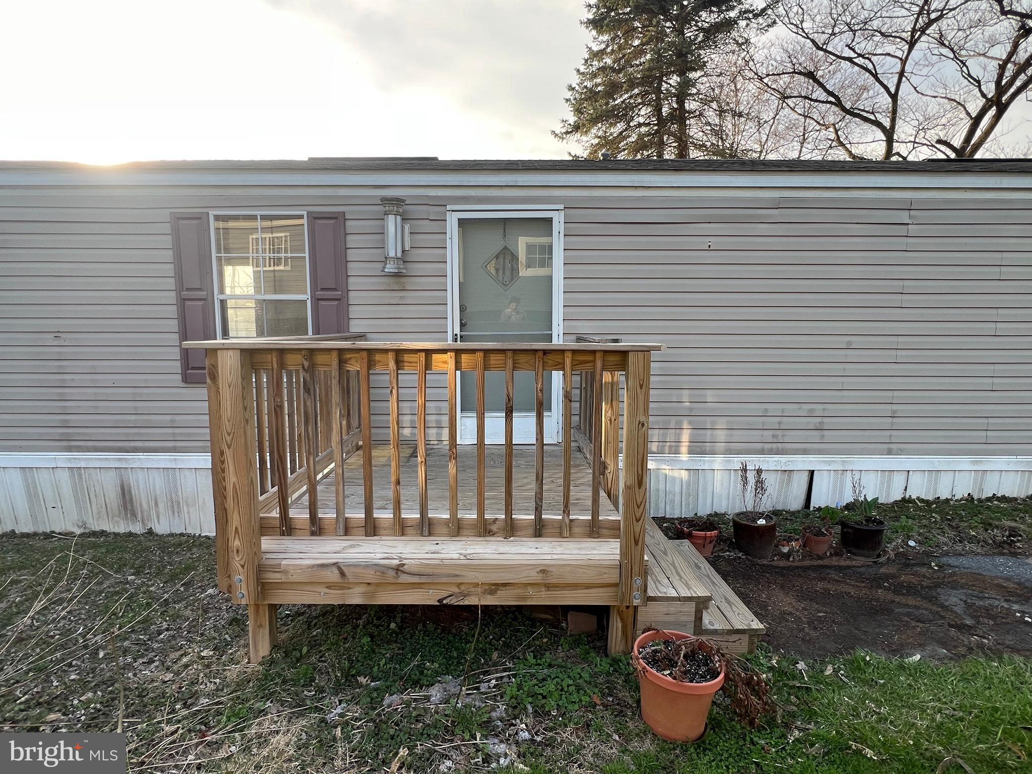 4328 Ridge Road, Unit 14 Mount Airy, MD 21771 - Photo 2 of 42 a view of a wooden deck and a backyard