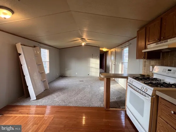 a kitchen with a sink a refrigerator and window