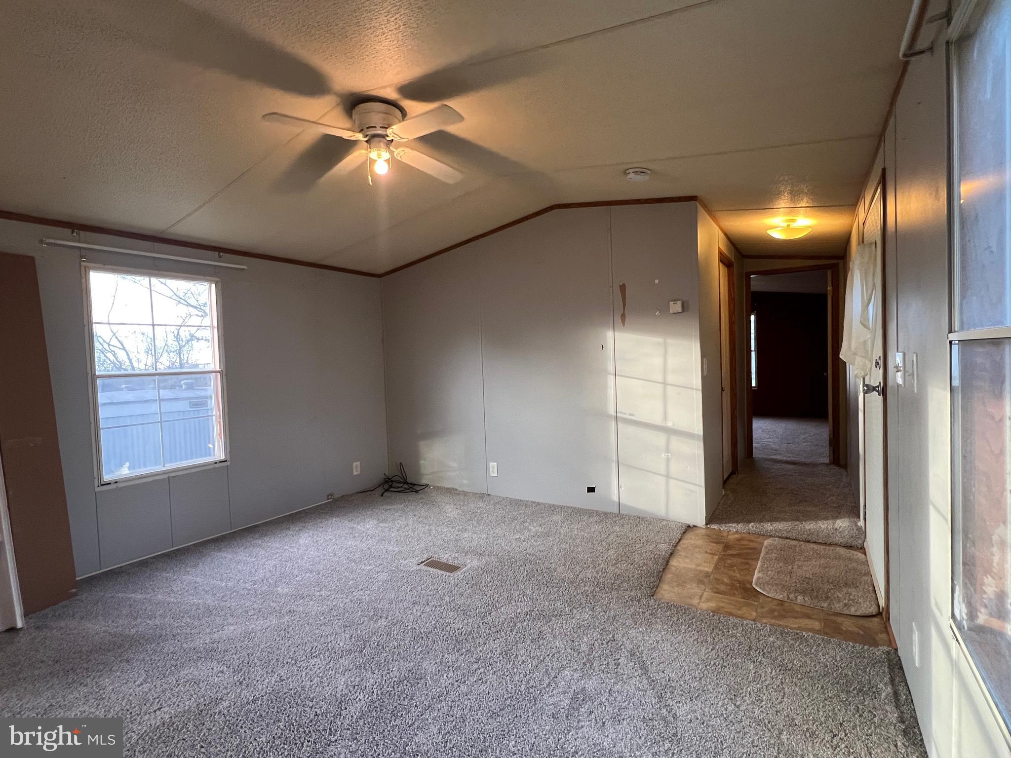 4328 Ridge Road, Unit 14 Mount Airy, MD 21771 - Photo 27 of 42 an empty room with fan and windows