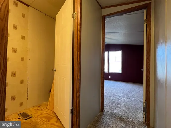 a bathroom with a sink a toilet and shower curtain