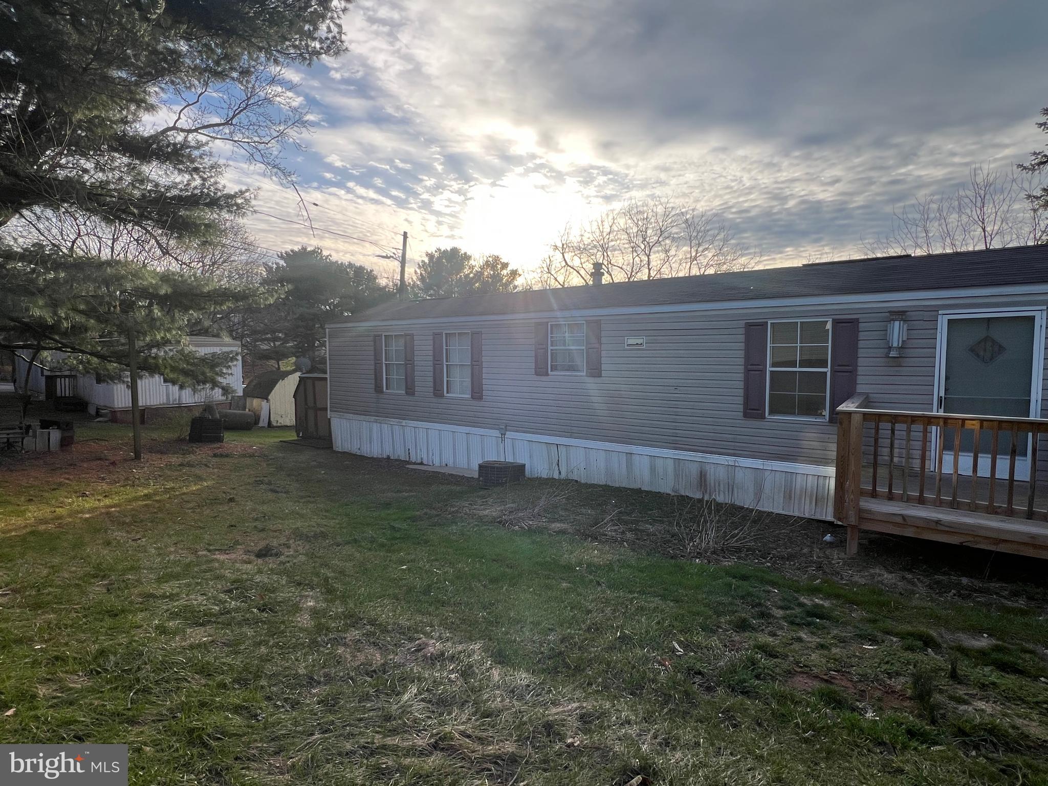 4328 Ridge Road, Unit 14 Mount Airy, MD 21771 - Photo 36 of 42 a view of a backyard with plants and large trees