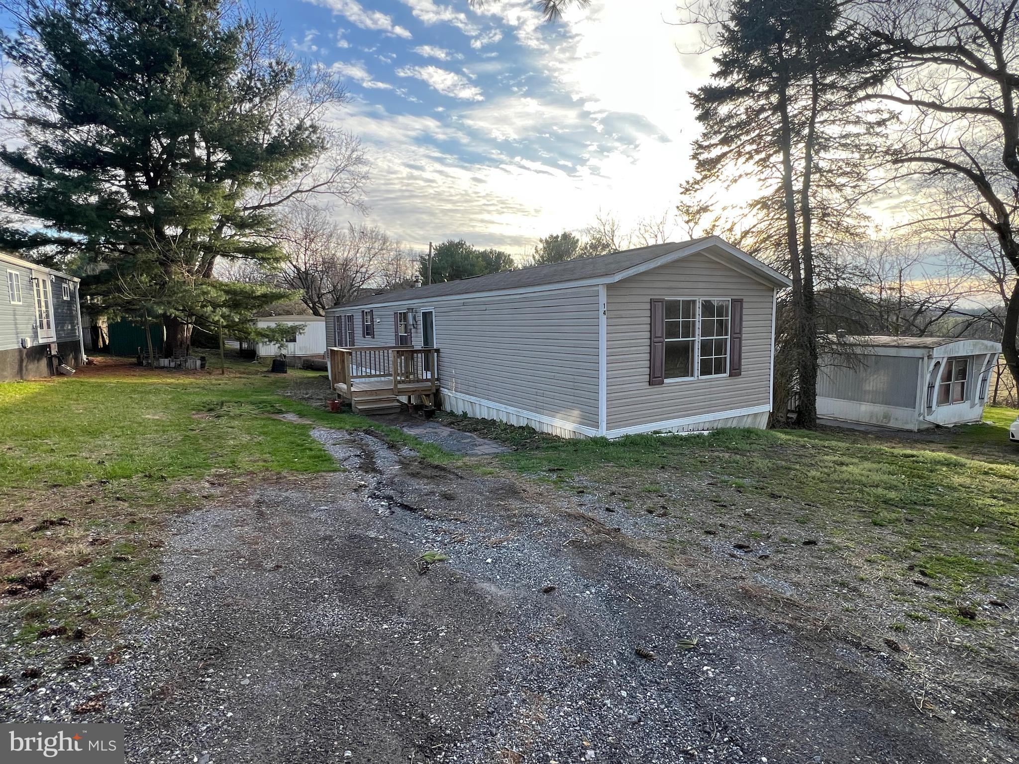 4328 Ridge Road, Unit 14 Mount Airy, MD 21771 - Photo 41 of 42 a view of a house with a yard