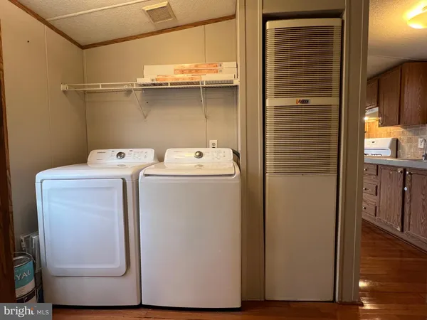 a utility room with dryer and washer