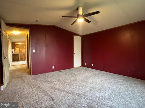 an empty room with closet area
