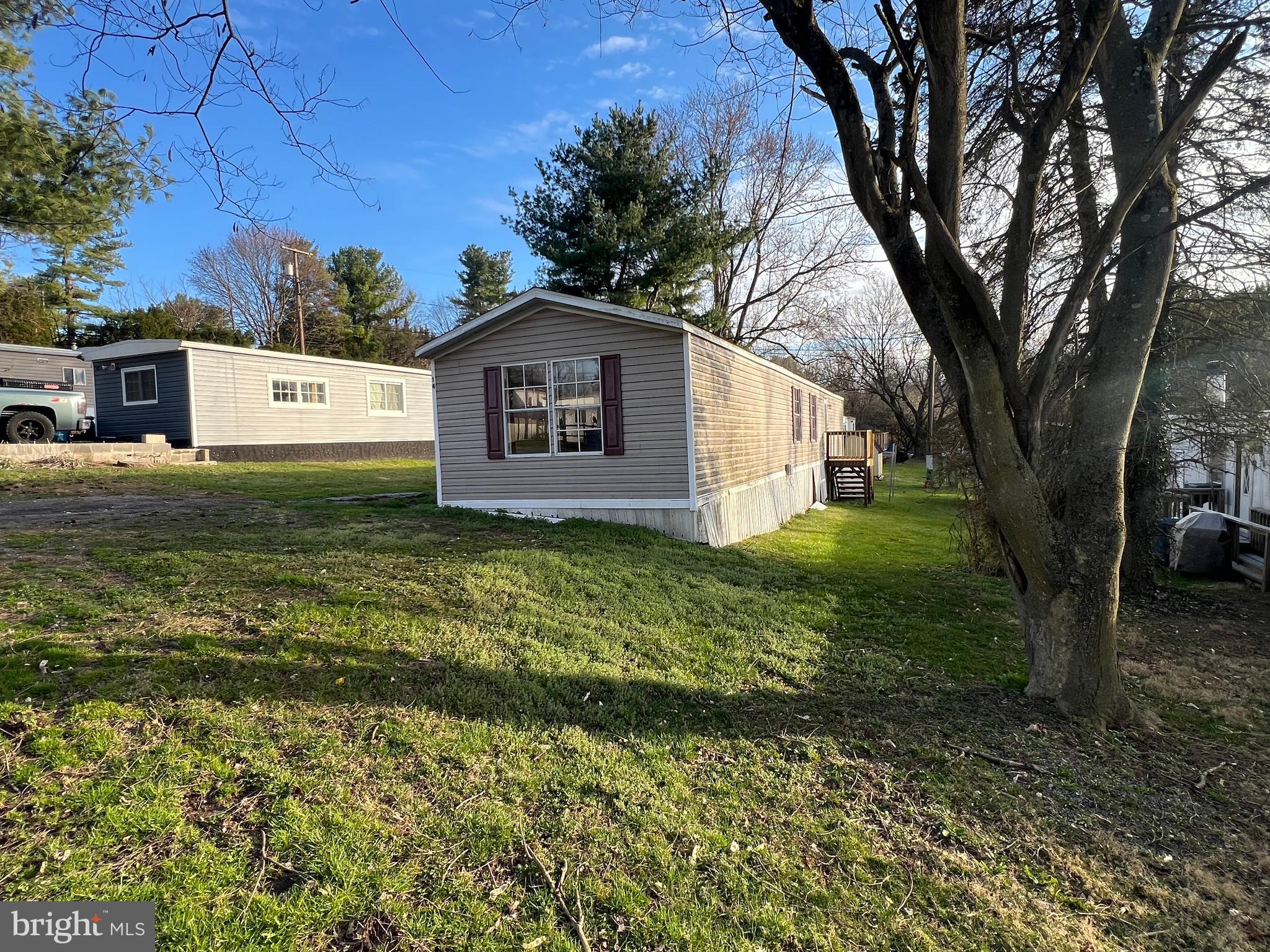 4328 Ridge Road, Unit 14 Mount Airy, MD 21771 - Photo 9 of 42 a white house that has tree in front of it