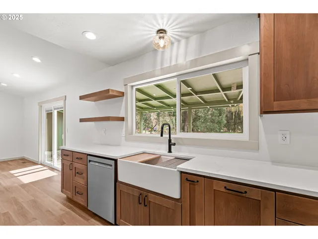 a kitchen with a sink and a window
