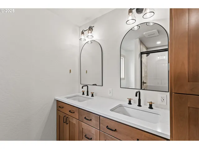 a bathroom with a sink and mirror
