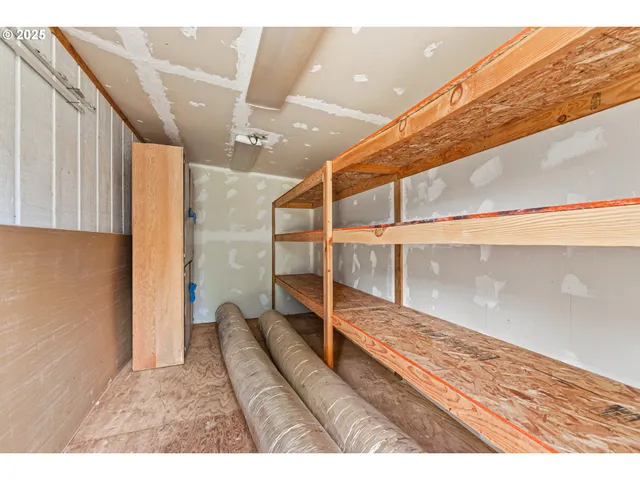 a view of a dining room with furniture a chandelier and wooden floor