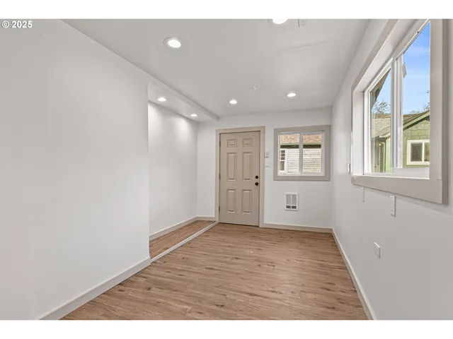 a view of an empty room with a window