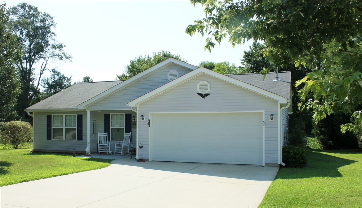 226 Rio Way Anderson, SC 29625 - Photo 1 of 16 Road view of home showing the double garage and fr