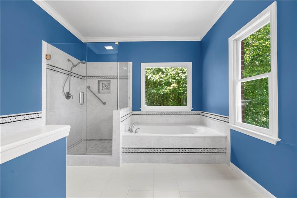 3334 Trails End Road Northeast Roswell, GA 30075 - Photo 30 of 54 a spacious bathroom with a tub sink and shower