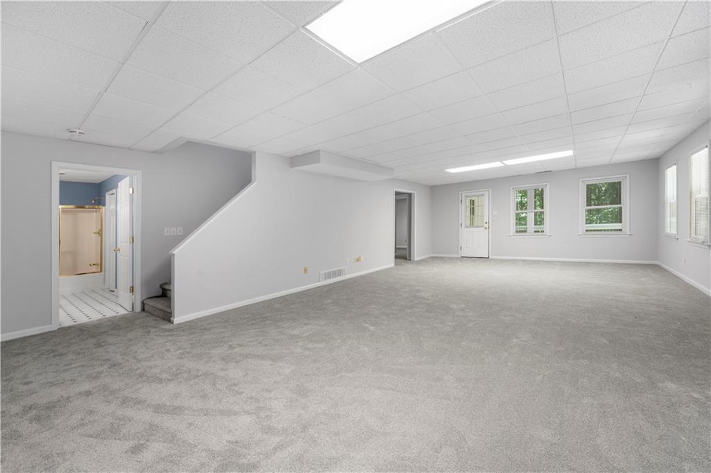 3334 Trails End Road Northeast Roswell, GA 30075 - Photo 41 of 54 a view of an empty room with windows