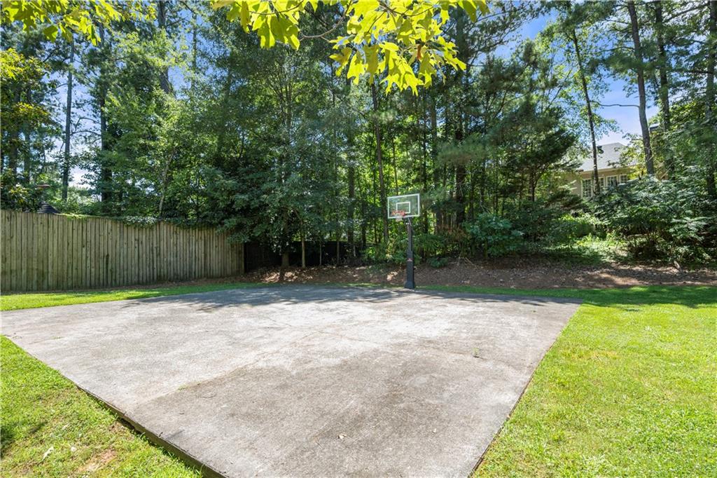 3334 Trails End Road Northeast Roswell, GA 30075 - Photo 50 of 54 a backyard of a house with lots of green space