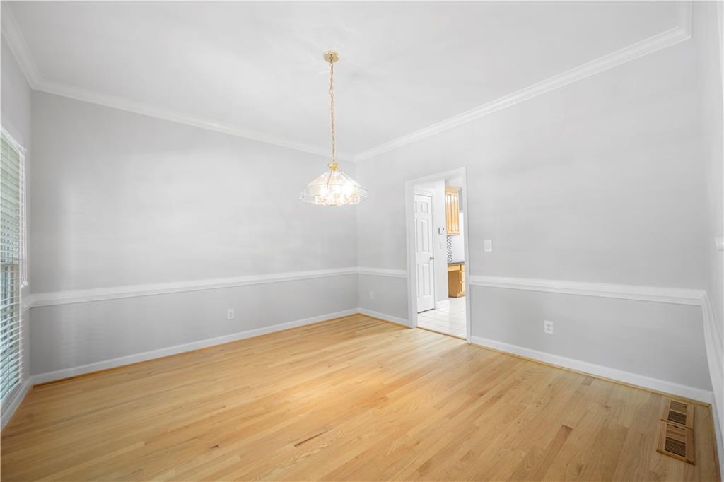 3334 Trails End Road Northeast Roswell, GA 30075 - Photo 6 of 54 a view of an empty room with a window