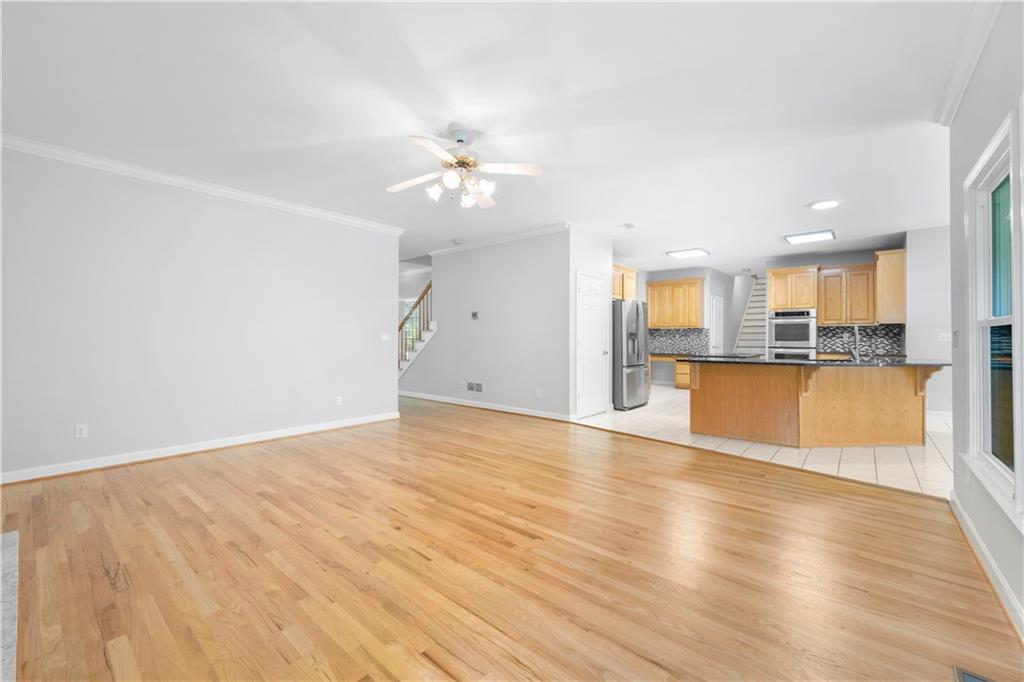 3334 Trails End Road Northeast Roswell, GA 30075 - Photo 8 of 54 a view of a kitchen with wooden floor and a kitchen