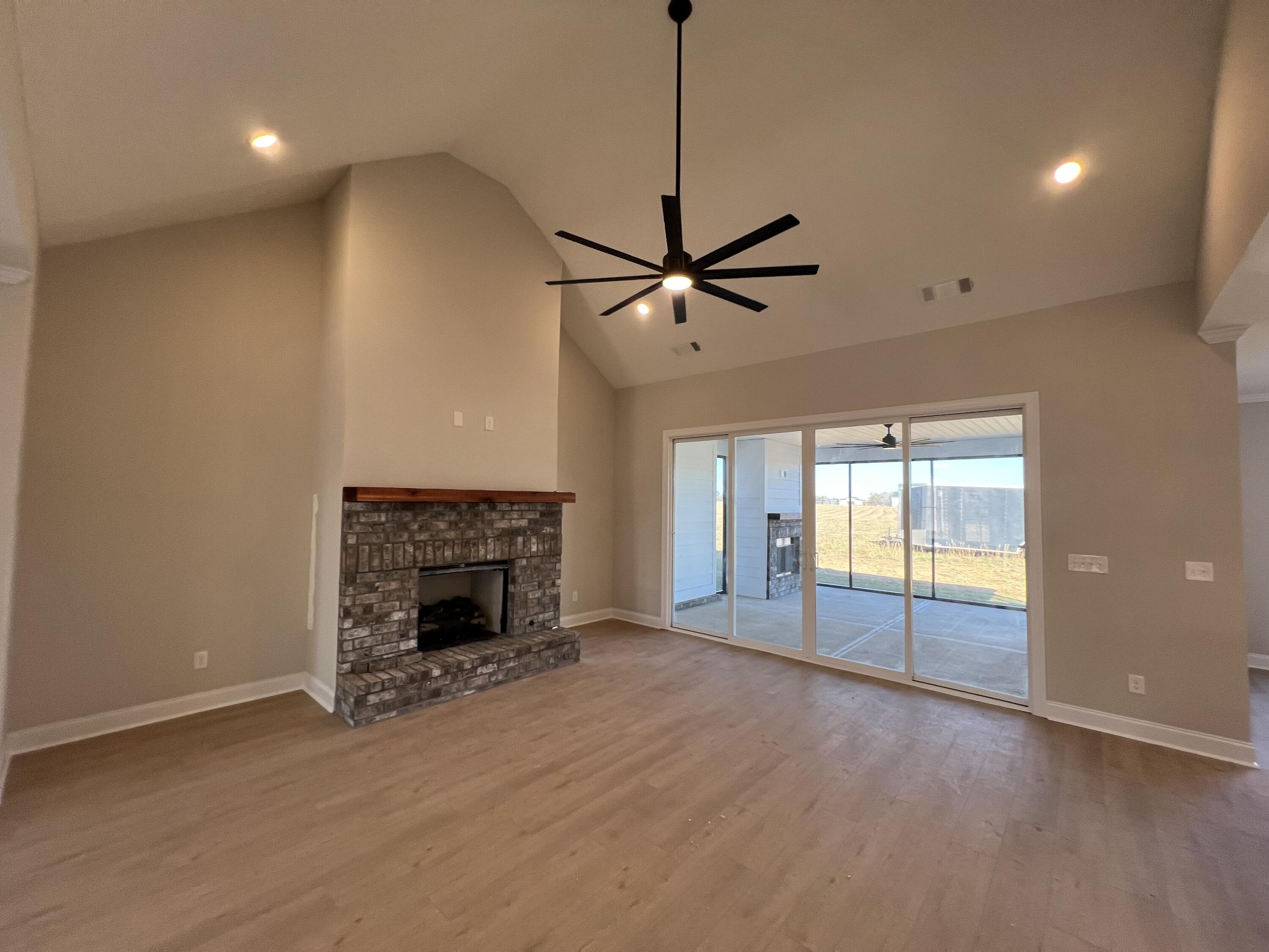 2747 Storm Branch Road Beech Island, SC 29842 - Photo 4 of 38 a view of an empty room with a fireplace and a window