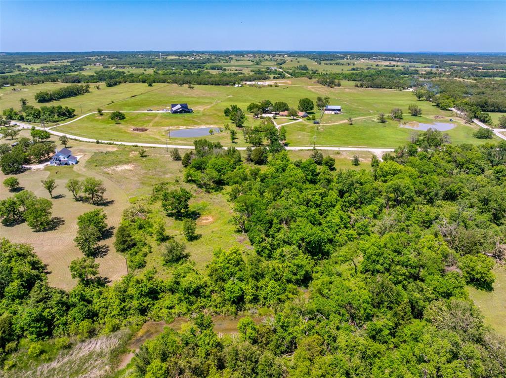 1874 County Road Springtown, TX 76082 - Photo 14 of 24 a view of an outdoor space and a yard