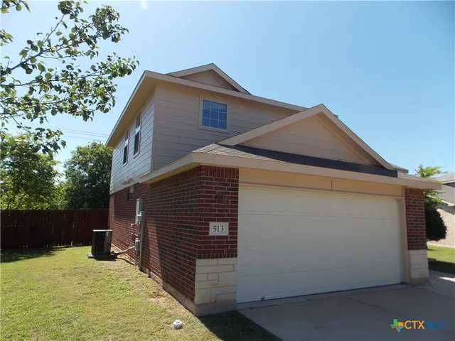 a kitchen with granite countertop a stove and a sink