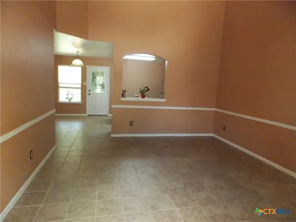a view of a room with window and bathroom