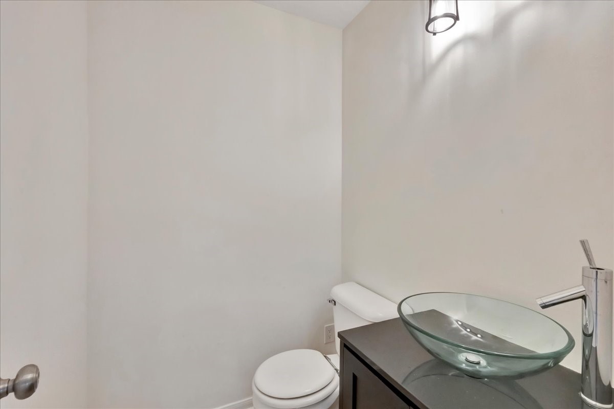 14010 Hazel Ridge Court Houston, TX 77062 - Photo 31 of 38 Powder room is centrally located downstairs across from kitchen.
