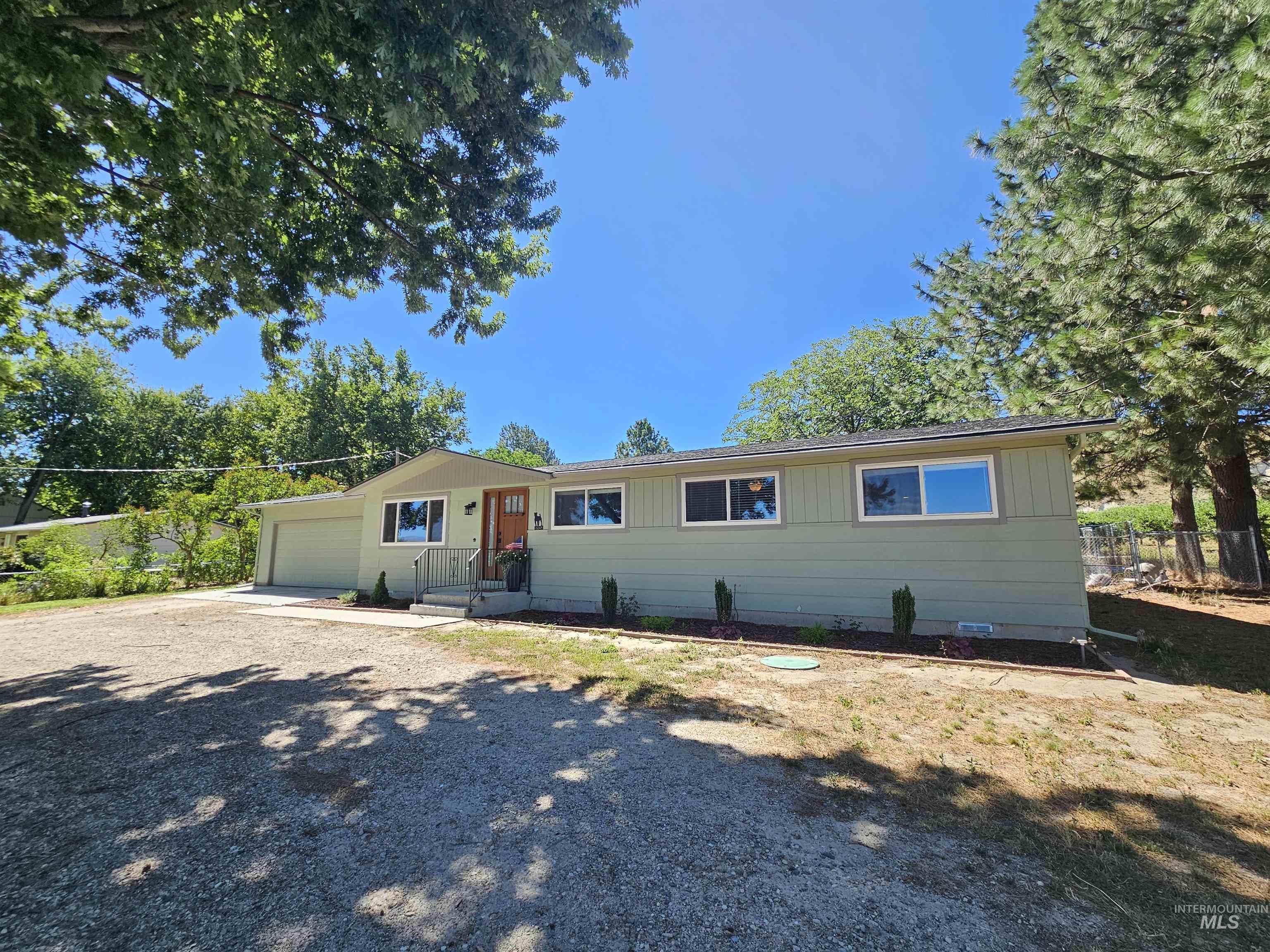 Single story home with an attached garage and driveway