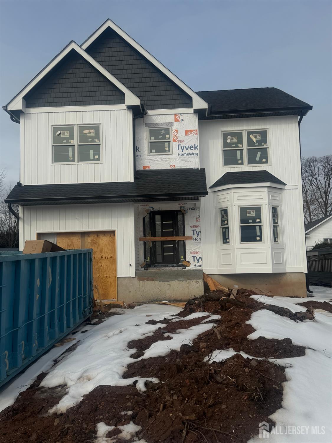 33 Apollo Avenue Avenel, NJ 07001 - Photo 2 of 11 a front view of a house with a yard