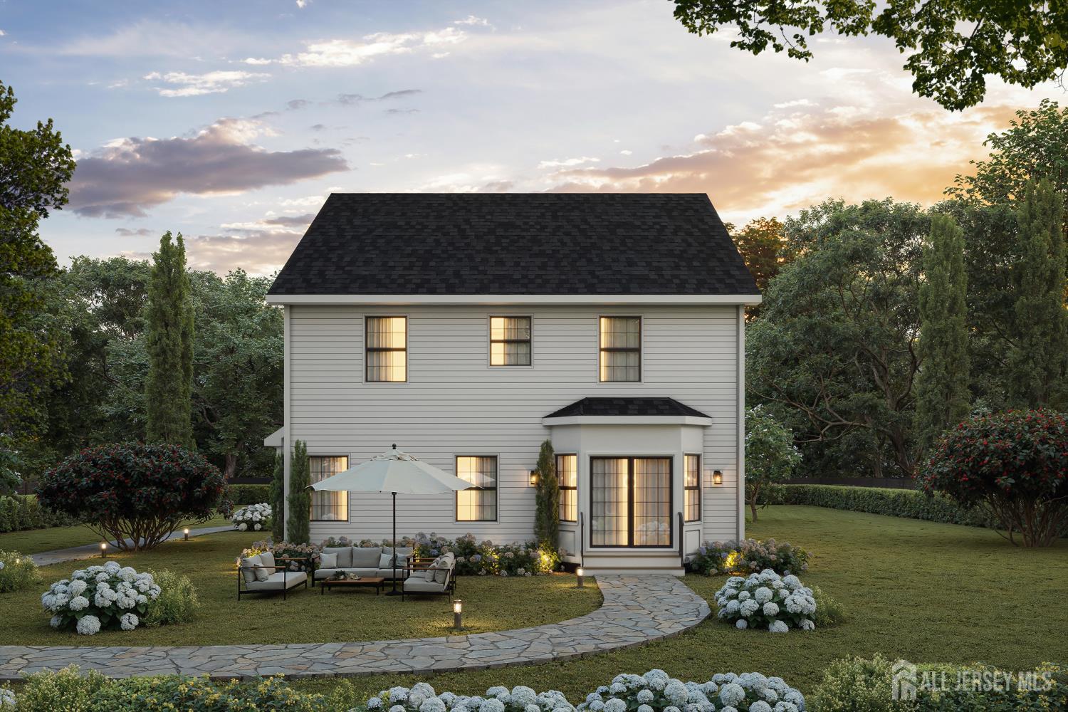 33 Apollo Avenue Avenel, NJ 07001 - Photo 4 of 11 a front view of a house with a garden