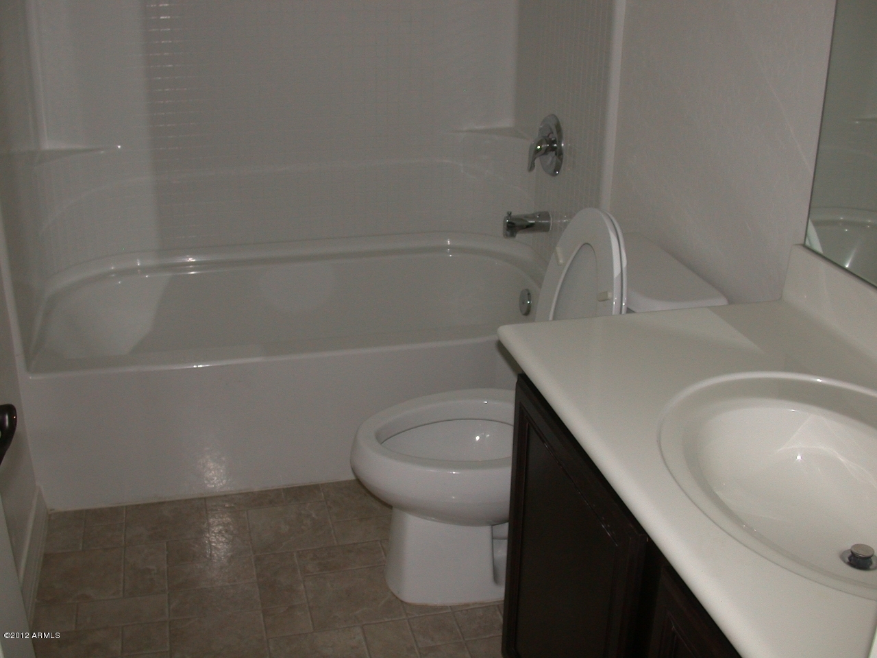 2423 West Bajada Road Phoenix, AZ 85085 - Photo 8 of 17 a bathroom with a sink a toilet and bathtub