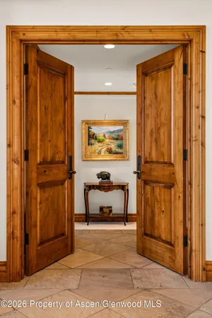 a view of hallway with stairs and furniture