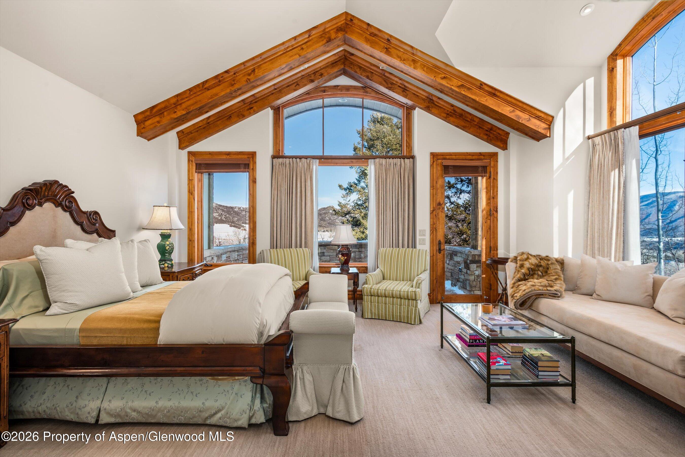 971 Cluny Road Aspen, CO 81611 - Photo 16 of 39 a living room with furniture a window and a chandelier