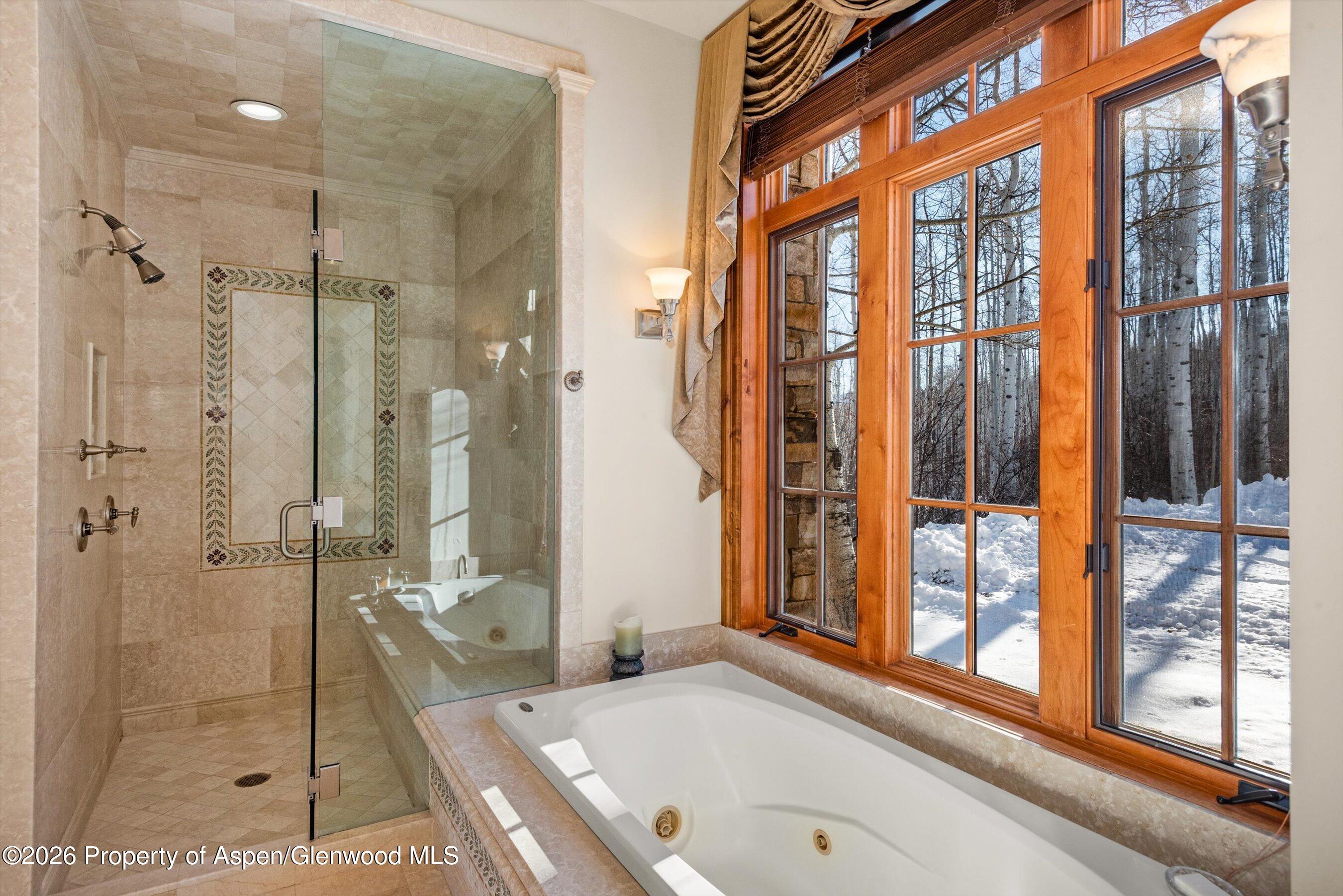 971 Cluny Road Aspen, CO 81611 - Photo 21 of 39 a bathroom with a granite countertop sink a mirror and next to a window