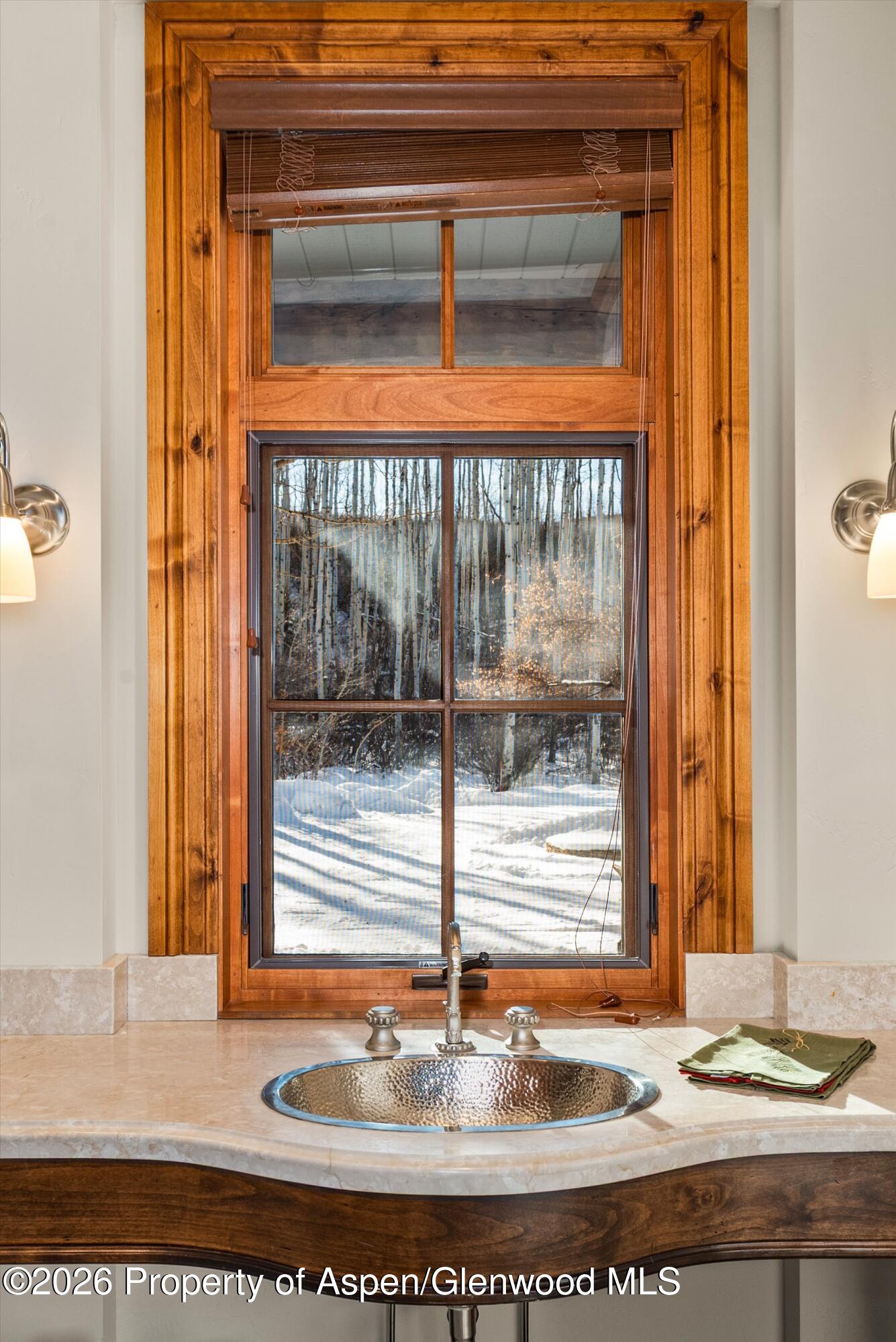971 Cluny Road Aspen, CO 81611 - Photo 22 of 39 a view of a bathroom sink and a window