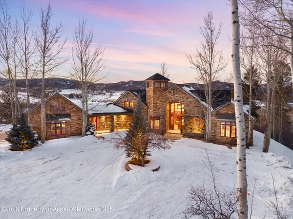 a view of a house with a snow in front of it