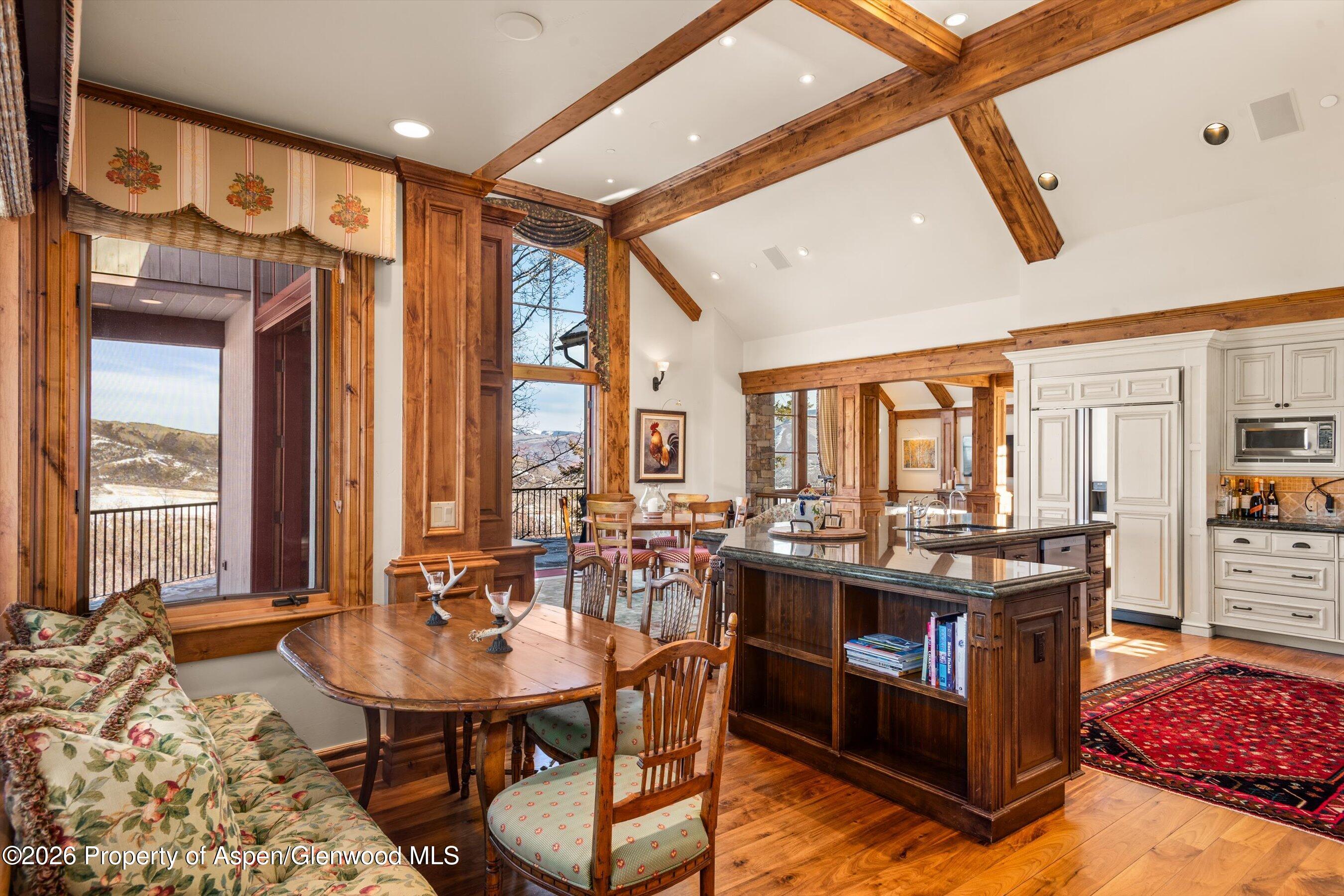 971 Cluny Road Aspen, CO 81611 - Photo 10 of 39 a view of a dining room with furniture and window