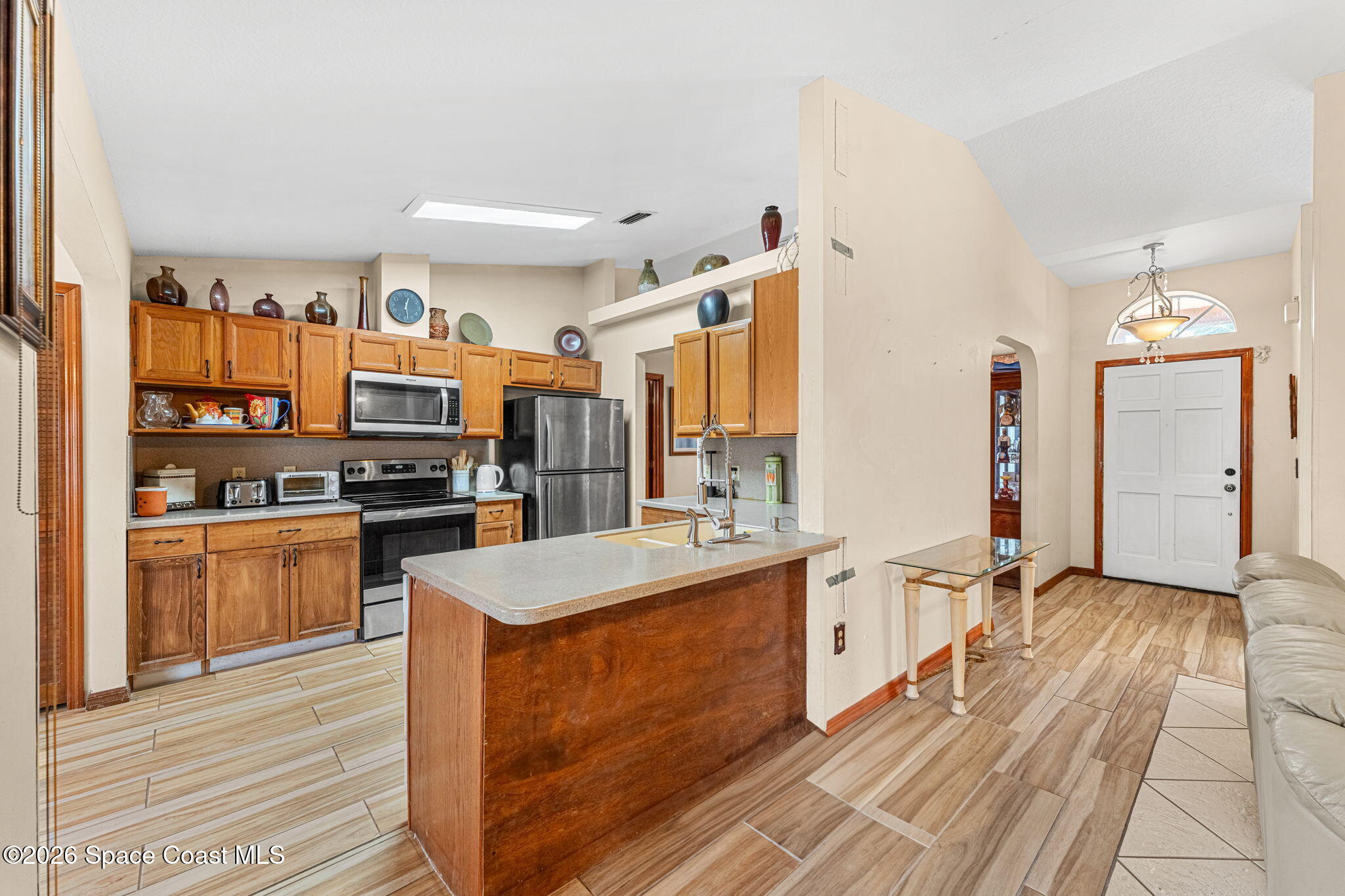 597 Balcom Terrace Southeast Palm Bay, FL 32909 - Photo 11 of 47 Kitchen to Living Room ViewsViews