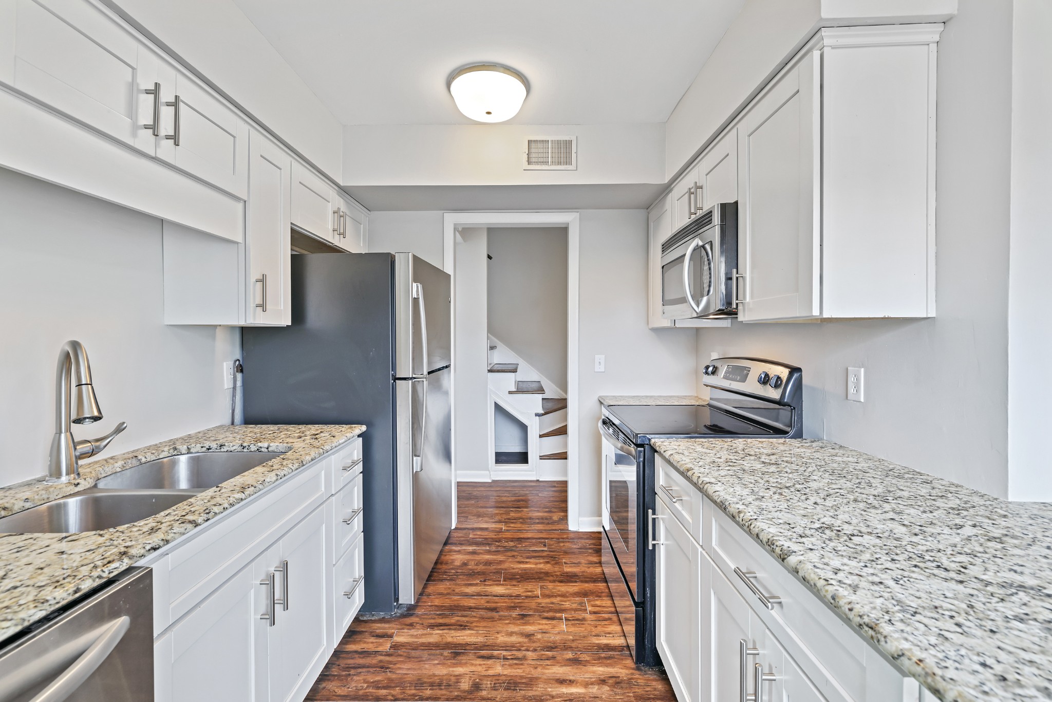 1900 Richard Jones Road, Unit V10 Nashville, TN 37215 - Photo 13 of 49 a kitchen with a sink stove and refrigerator