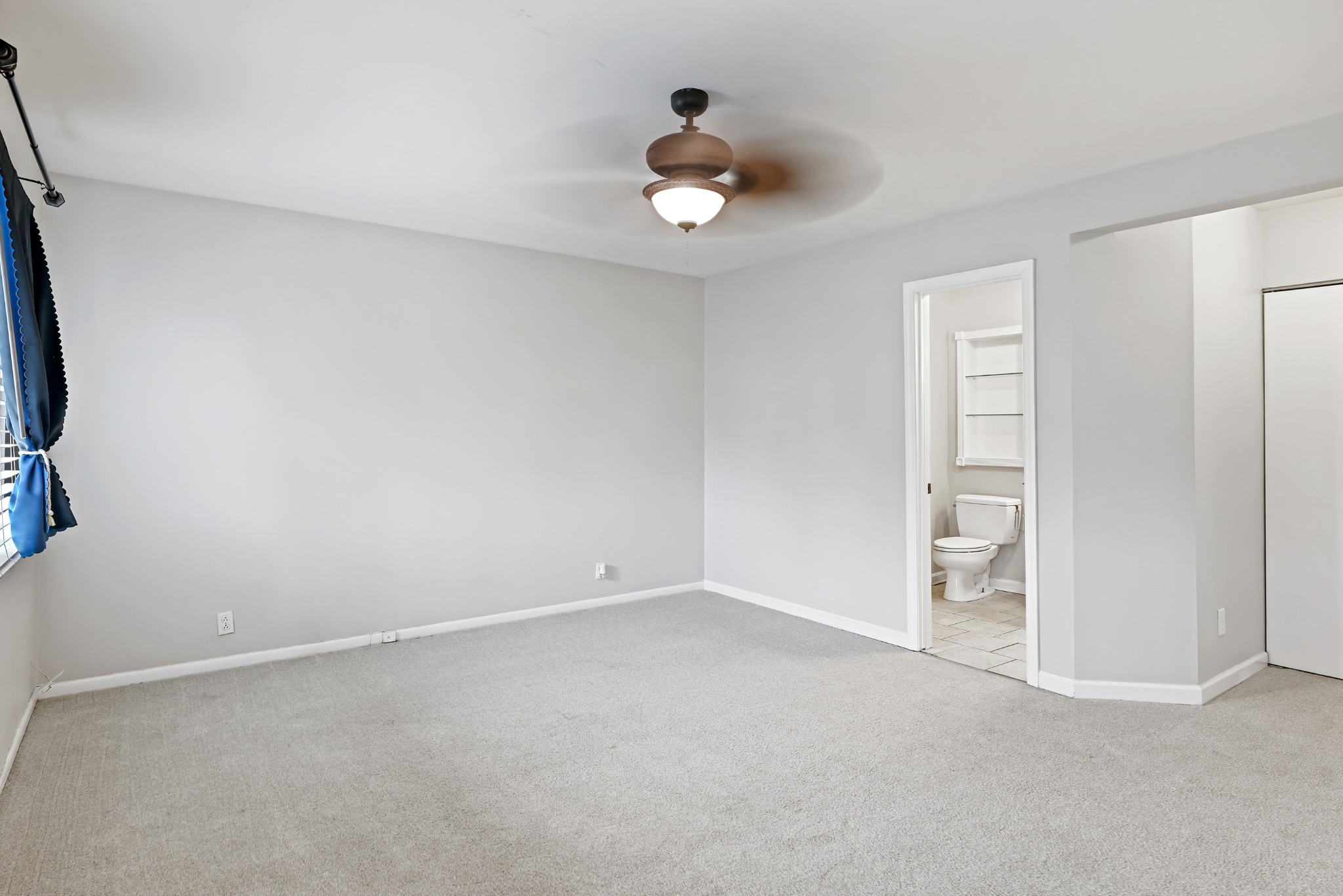 1900 Richard Jones Road, Unit V10 Nashville, TN 37215 - Photo 21 of 49 a view of an empty room with a ceiling fan
