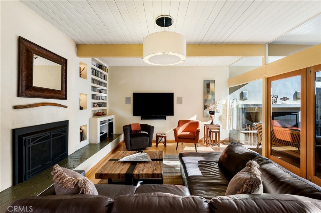 253 Ancona Drive Long Beach, CA 90803 - Photo 15 of 39 a living room with furniture fireplace and flat screen tv