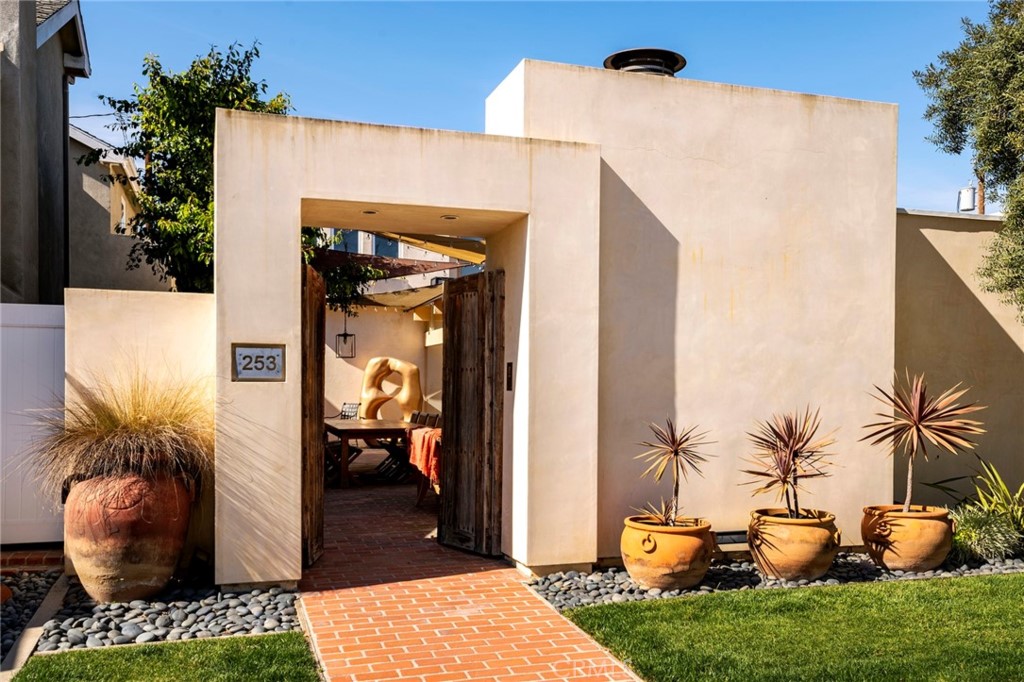 253 Ancona Drive Long Beach, CA 90803 - Photo 2 of 39 a view of a porch with potted plants