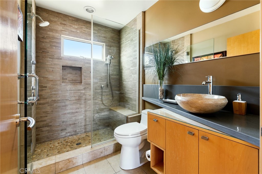 253 Ancona Drive Long Beach, CA 90803 - Photo 23 of 39 a bathroom with a sink toilet and shower
