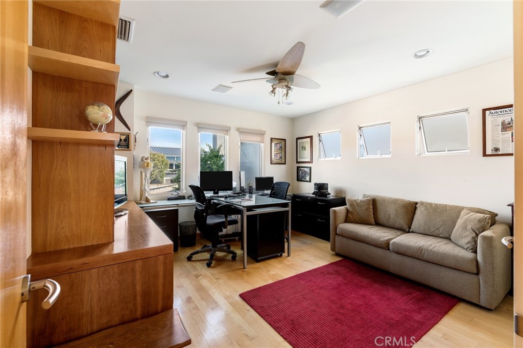 253 Ancona Drive Long Beach, CA 90803 - Photo 24 of 39 a living room with furniture a rug and a piano