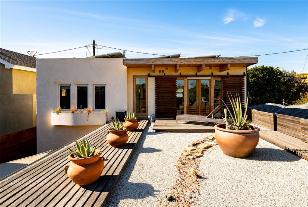 253 Ancona Drive Long Beach, CA 90803 - Photo 29 of 39 a view of a patio with dining table and chairs