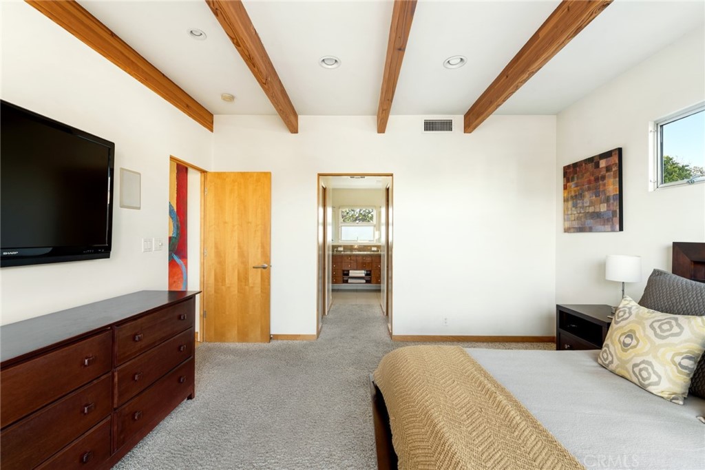 253 Ancona Drive Long Beach, CA 90803 - Photo 31 of 39 a bedroom with a bed and flat screen tv