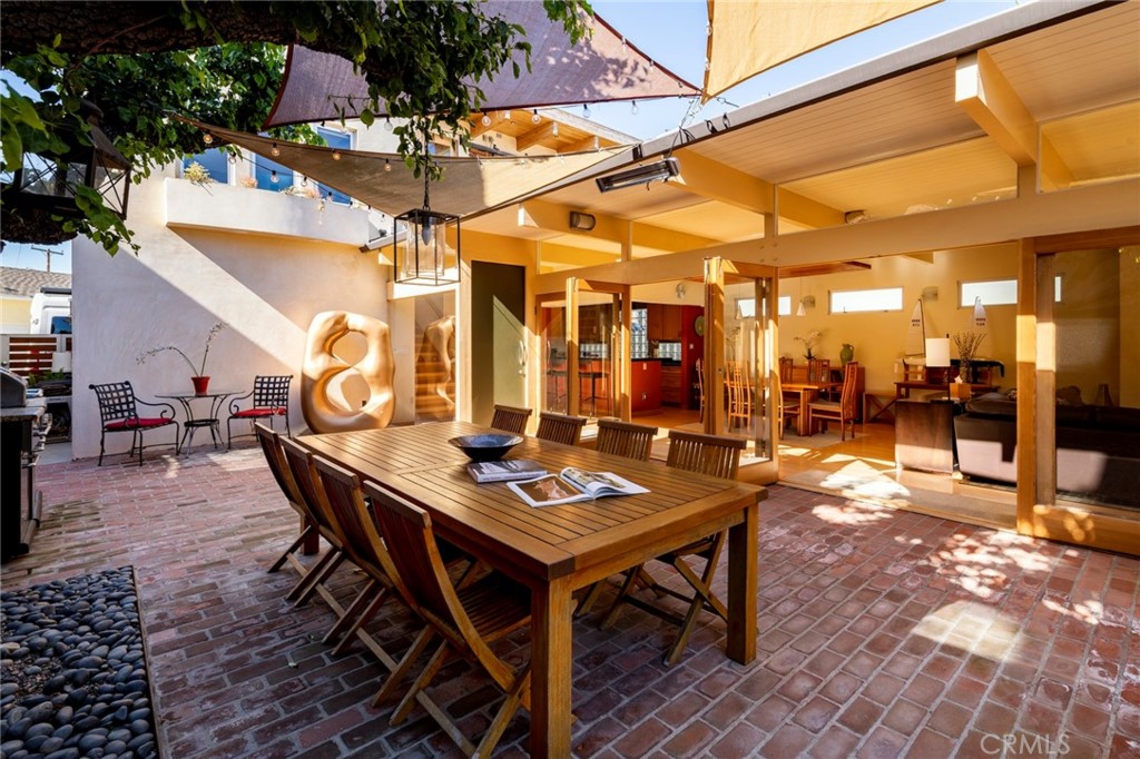 253 Ancona Drive Long Beach, CA 90803 - Photo 4 of 39 a view of a dinning table and chairs in the patio