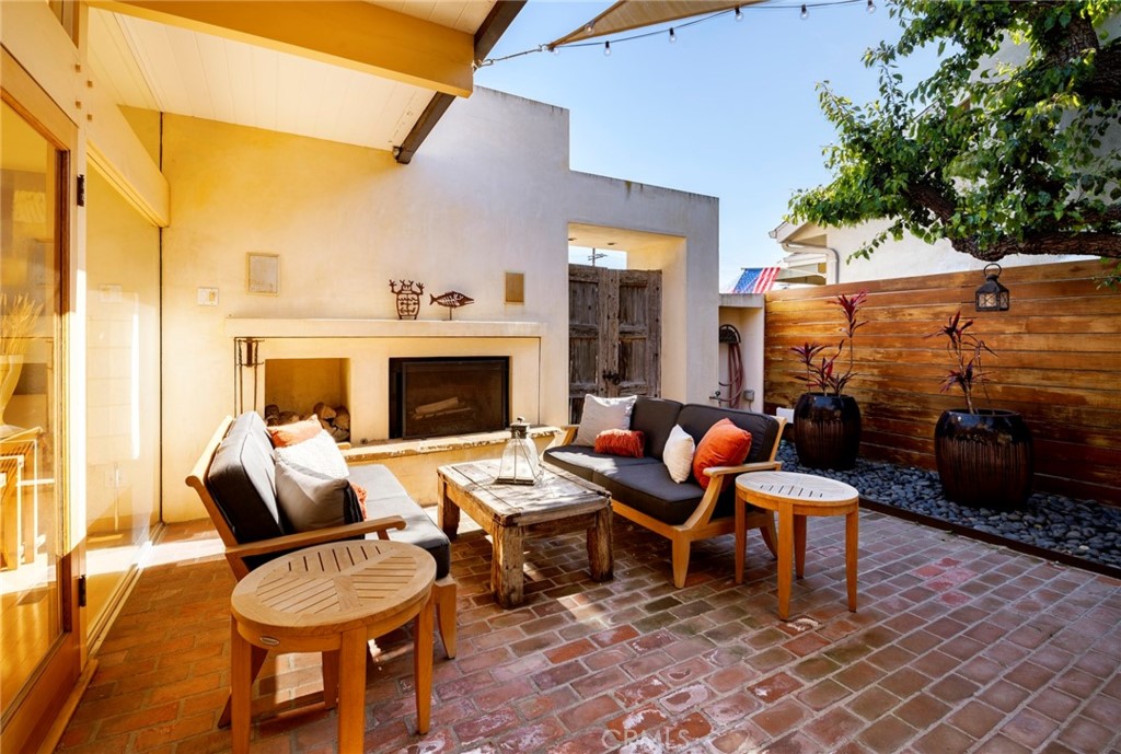 253 Ancona Drive Long Beach, CA 90803 - Photo 5 of 39 a outdoor space with patio couches and a fireplace