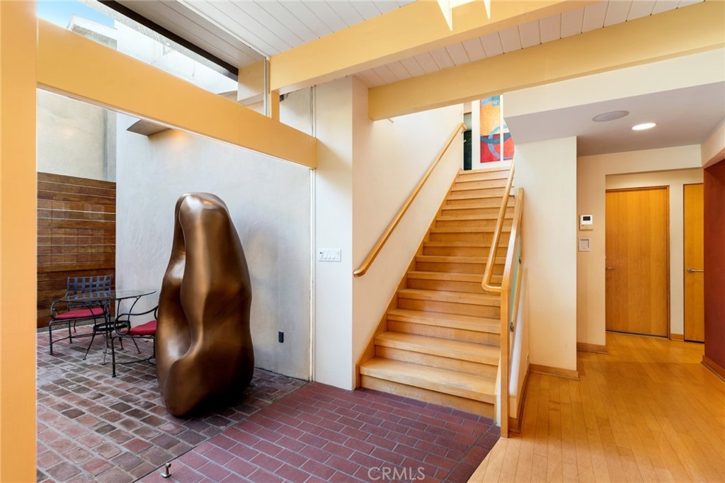 253 Ancona Drive Long Beach, CA 90803 - Photo 10 of 39 a view of a hallway with wooden floor and staircase