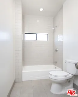 a bathroom with a toilet a sink and a bathtub