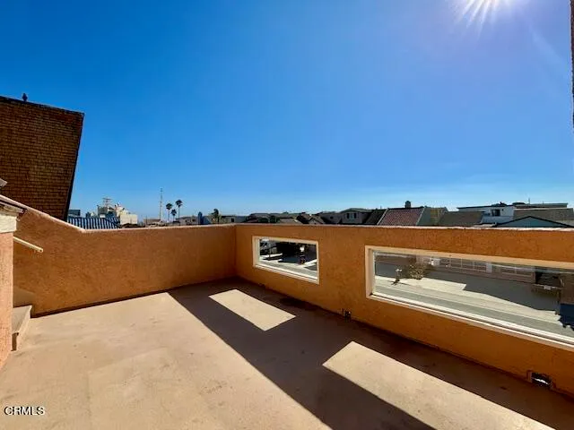 an aerial view of residential houses with city view