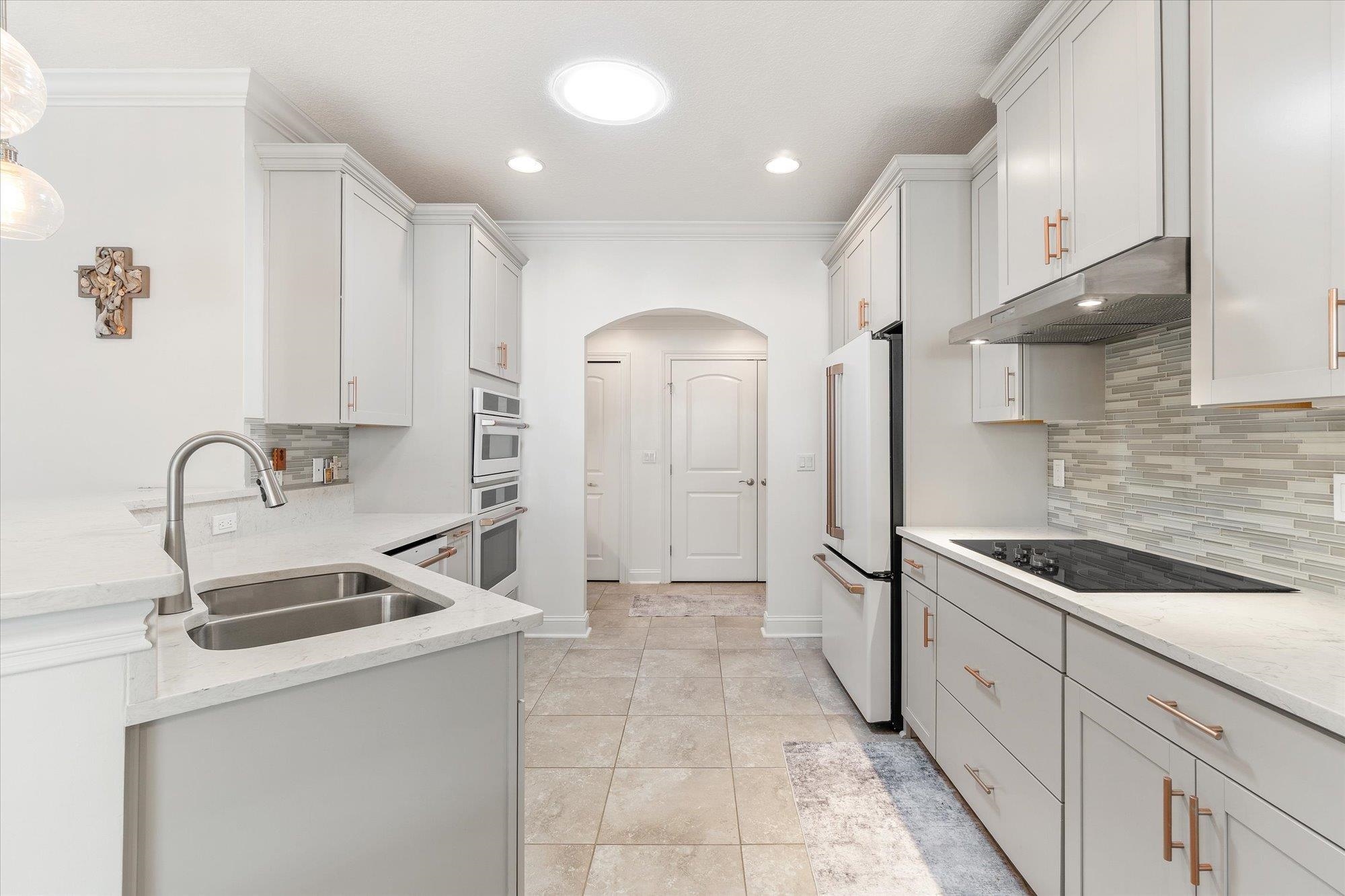 82 Timoga Trail St. Augustine, FL 32084 - Photo 18 of 62 a kitchen with stainless steel appliances granite countertop a sink and a refrigerator